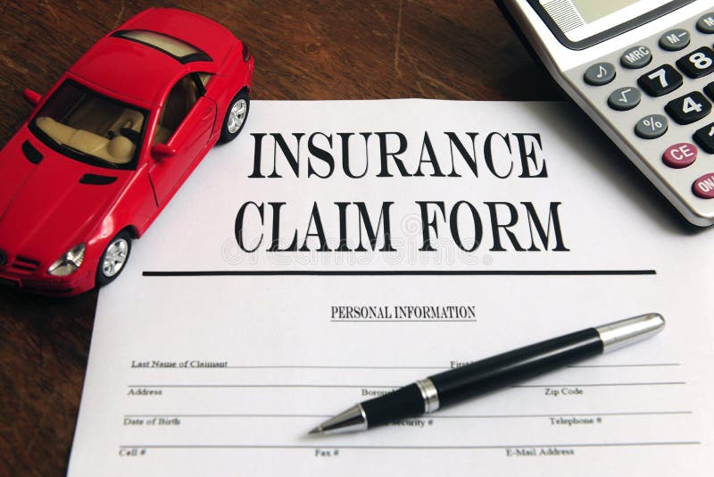 Car insurance claim form on desk