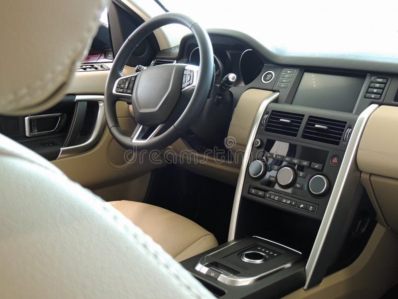 Car Interior with Cream Colored Leather and Aluminium Trim Stock Image