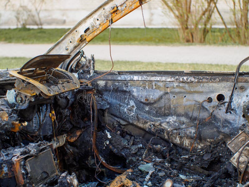 Car Interior after Fire. Selective Focus on Burned Side Door Stock