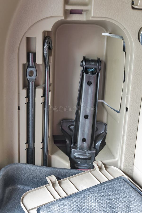 Car Jack and Tire Iron in Storage Compartment Stock Photo Image of files, people 58401408