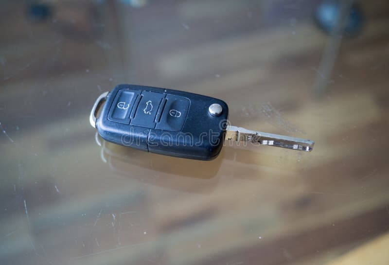Car key on glass table stock image. Image of open, used 103815273