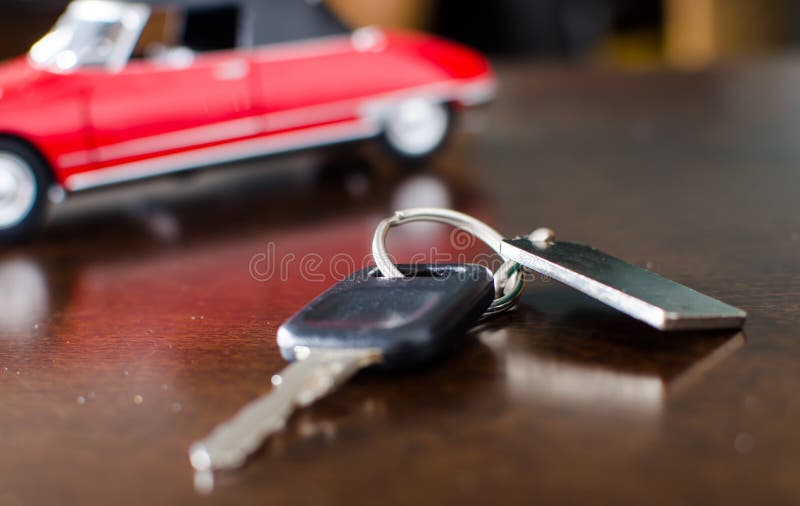 Car key on a wooden table stock image. Image of unlock 47735507