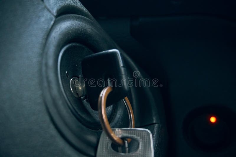 The Car Keys are Inserted into the Keyhole, the Keys To Start the Car