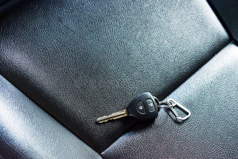 Car Keys on Leather Seats. People the Car Keys in the Car Stock
