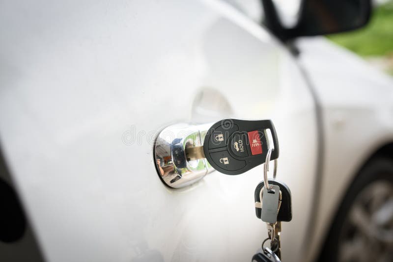 Car keys left in a lock stock image. Image of black 253382055