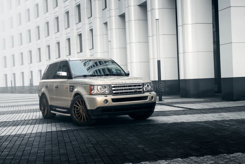 Car Land Rover Range Rover stand near modern building in Moscow city at daytime