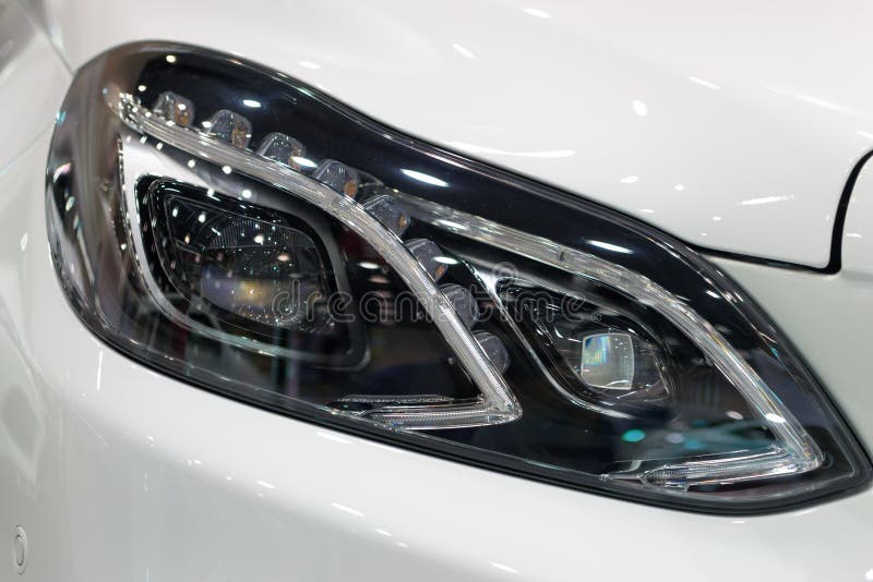 Modified Headlights Of Tuned Purple Candy Colored Lowrider. Stance