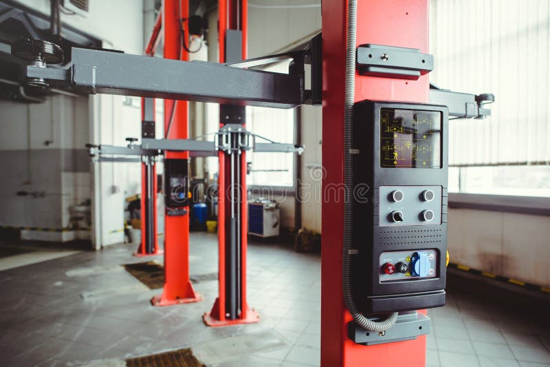 Car Lift in Car Service with Soft Focus, Car Maintenance Stock Photo