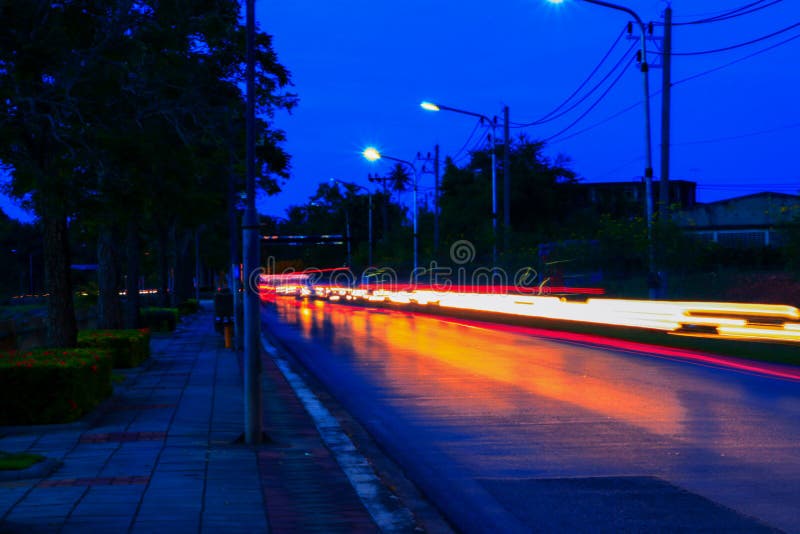 Car Lights at Night in City and Headlights. Long Exposure with Copy