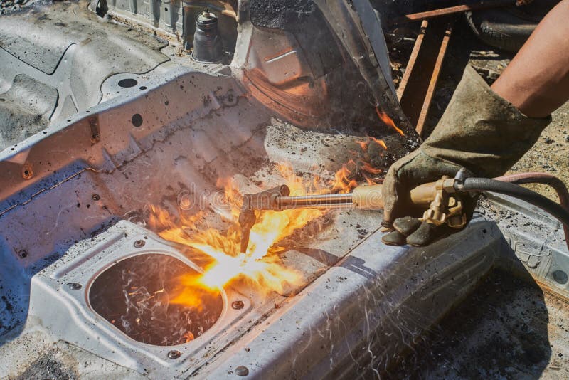 Car Mechanic Cut Car Frame by Oxygen Acetylene Cutting Technique Stock