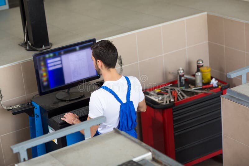 Car Mechanic Doing Car Diagnostic Stock Photo Image of indoor