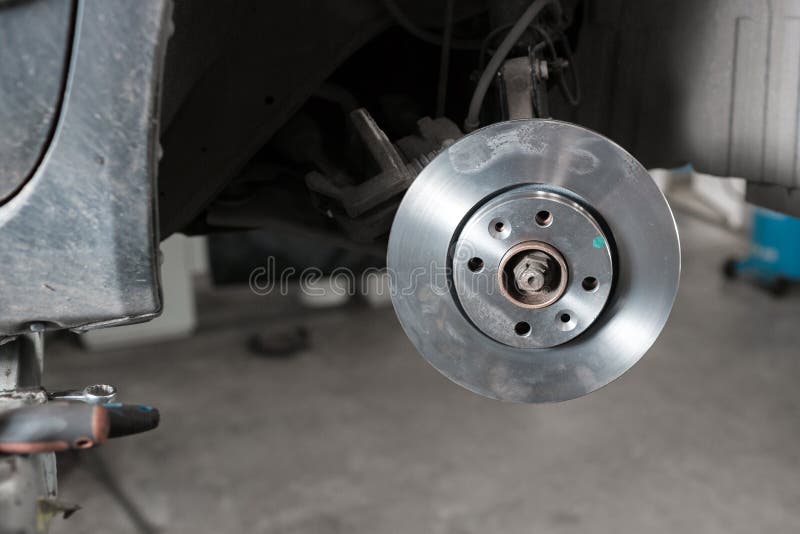 Car Mechanic Hands Replace Brakes in Garage. Stock Image Image of