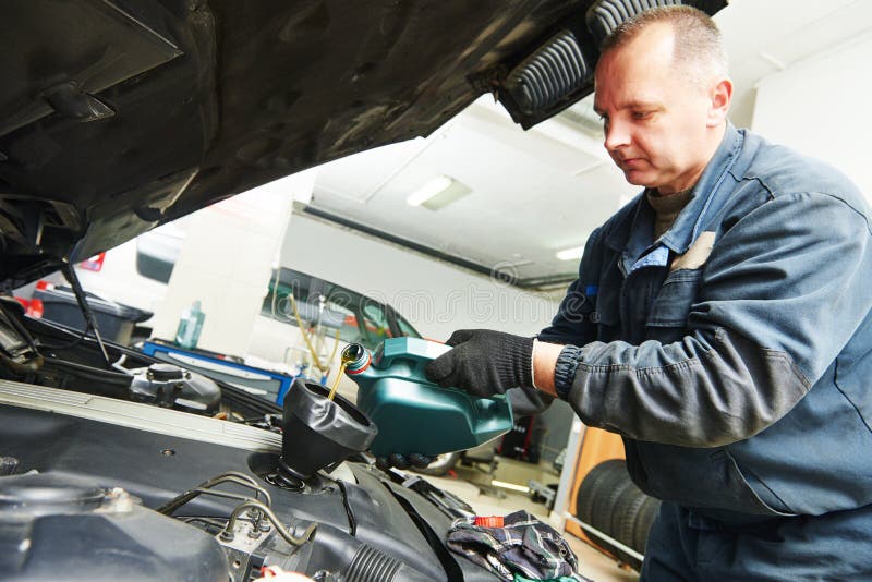 Car Mechanic Pouring Oil into Motor Engine Stock Image - Image of ...
