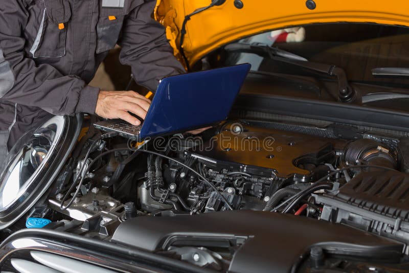 Car mechanic with a tablet stock image. Image of digital 60946025