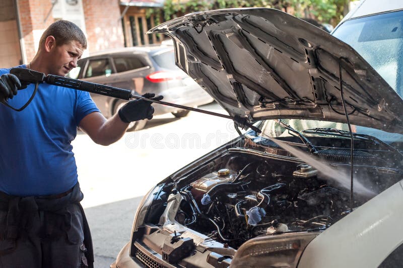The Mechanic Washes His Dirty Hands after a Working Day Stock Photo