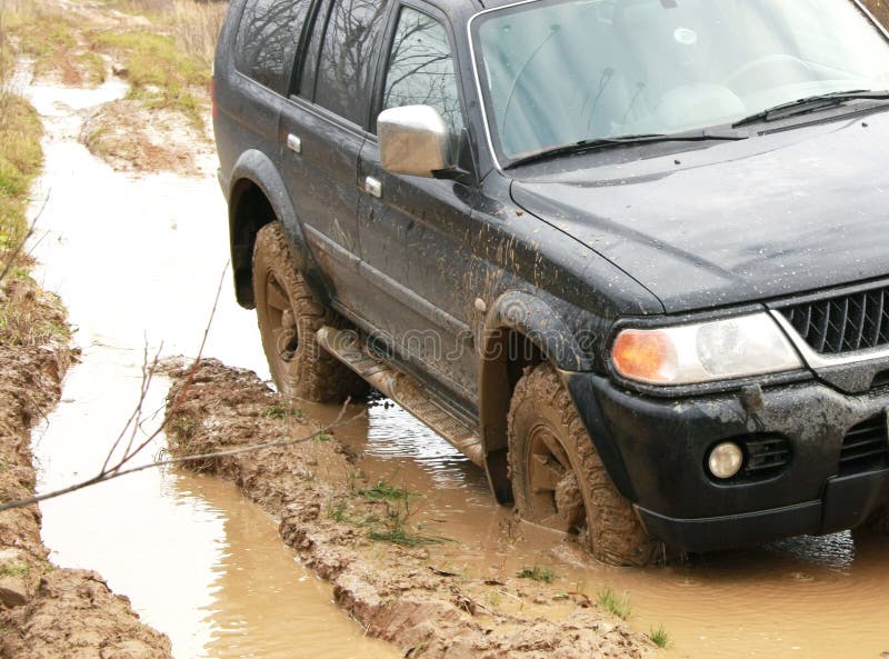 Car in mud in the forest, off-road royalty free stock photography