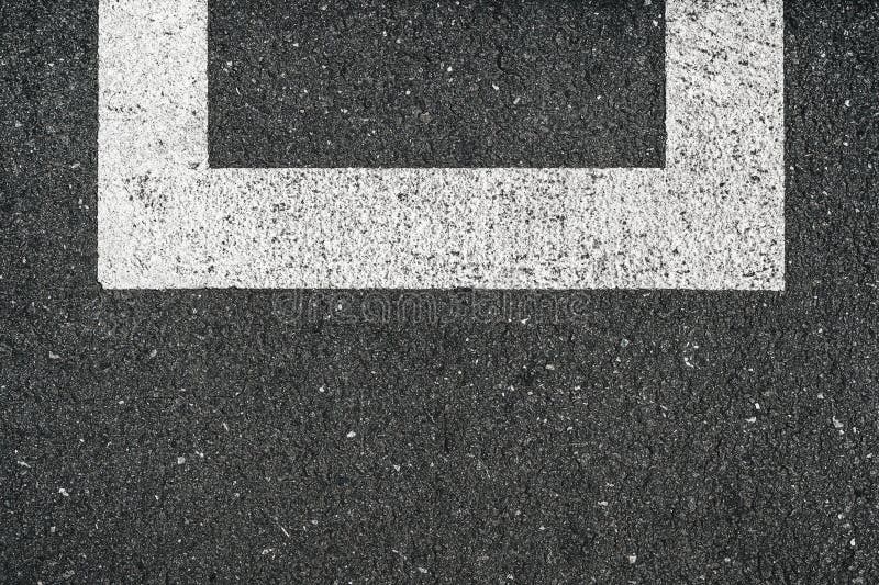 Car parking road marking white lines on asphalt surface as abstract pattern stock photo