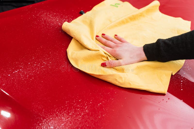 Car Polishing with Yellow Microfiber Cloth. Protection of Paintwork
