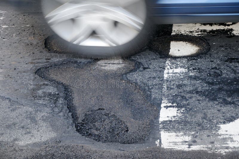 Car and pothole stock photography Car and pothole stock photography