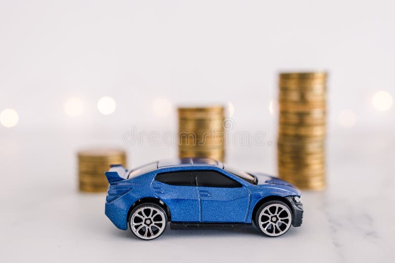 Car prices going up, toy car in front of increasing stacks of coins royalty free stock images