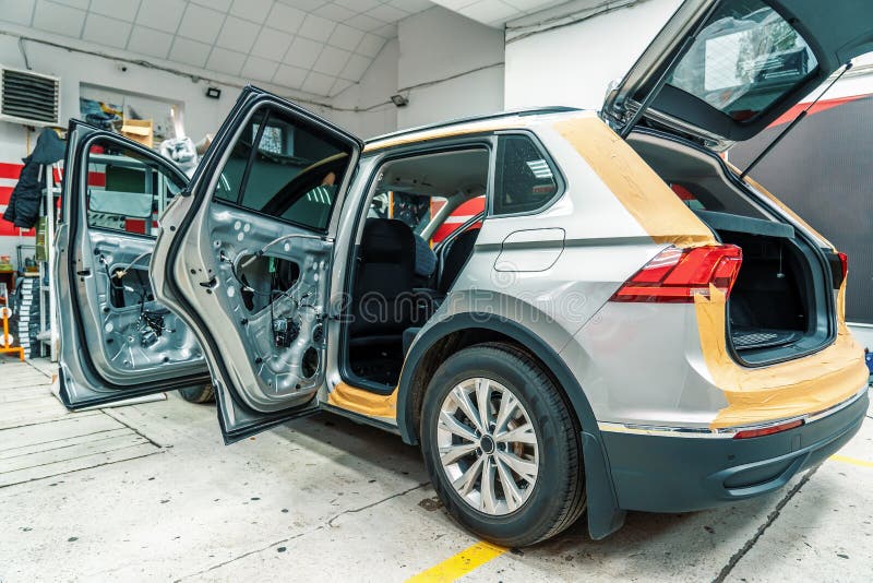 Car in Process of Installing Noise Insulation, Disassembled Doors