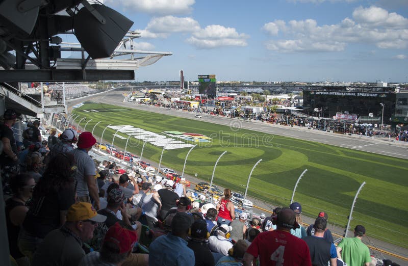 Car racing and fans. Competition at Daytona International speedway.