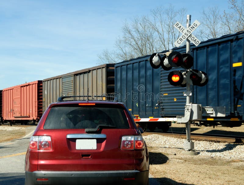 Car at railroad crossing