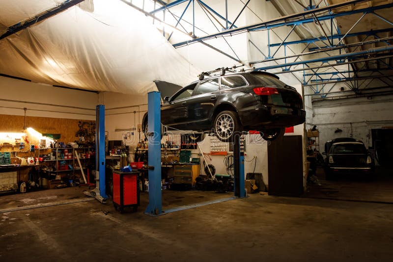 Car Raised on Car Lift at Auto Repair Service Stock Photo Image of