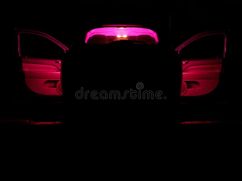 Car with a Red Light Inside on a Dark Night. Stock Photo Image of