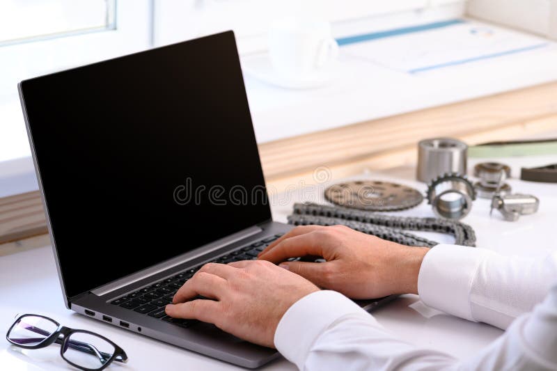 . Car Repair Courses. on the Table are a Computer and Tools for Car