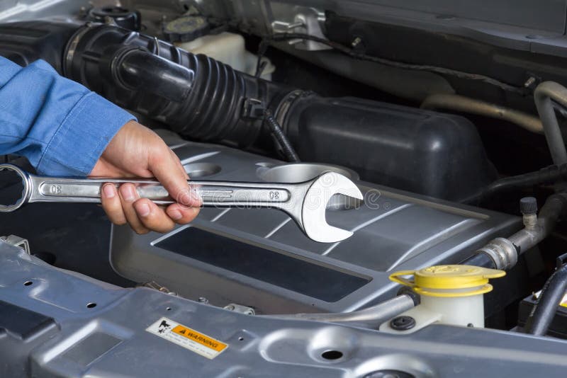 Car repair service, Auto mechanic holding a wrench royalty free stock image Car repair service, Auto mechanic holding a wrench royalty free stock image
