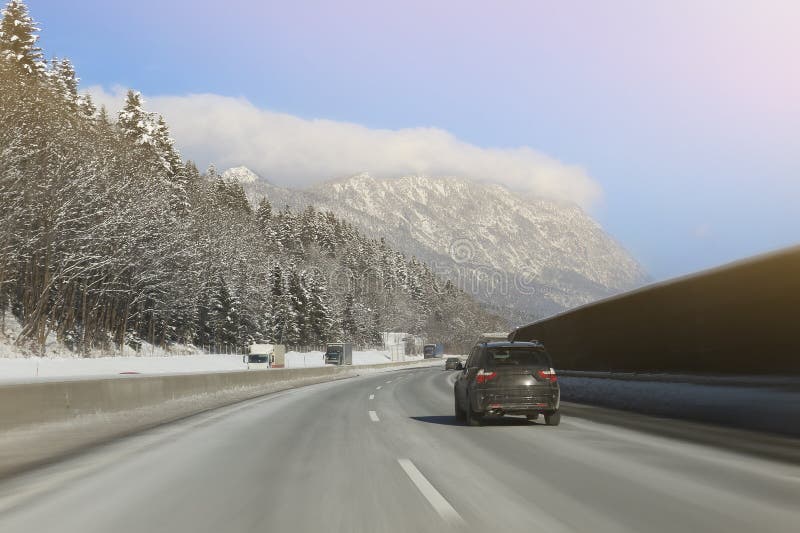 Car Running On Curve Of Empty Winter Highway Road With Beautiful