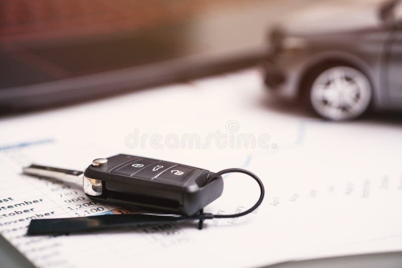 Car sales chart concept visual. car keys, graphics and calculator.