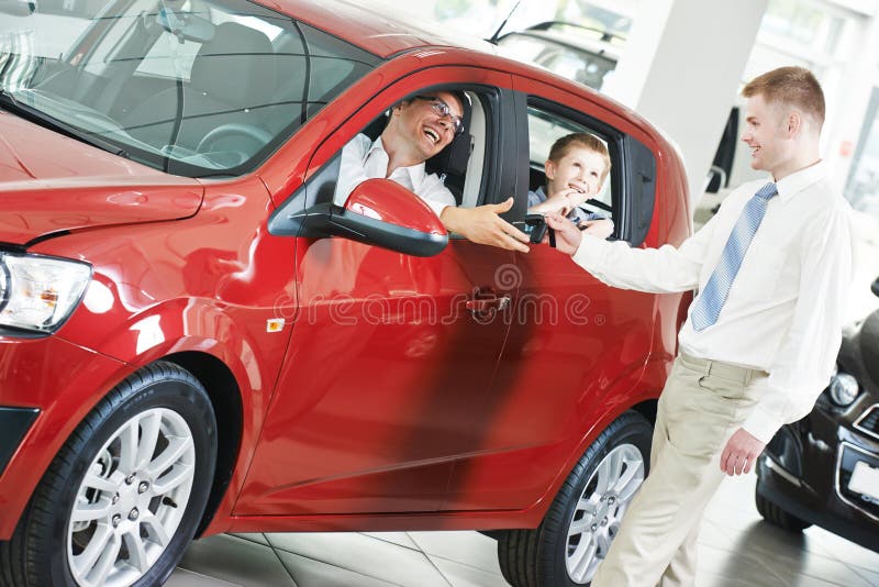 Car selling or auto buying. Sale peson giving keys stock image Car selling or auto buying. Sale peson giving keys stock image