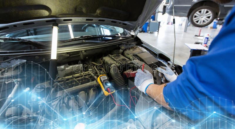 Premium Photo  Auto service, repair and maintenance concept - digital  multimeter or voltmeter testing car battery.