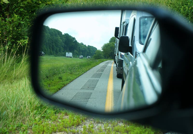 Rumble Strips on Road in Car Mirror