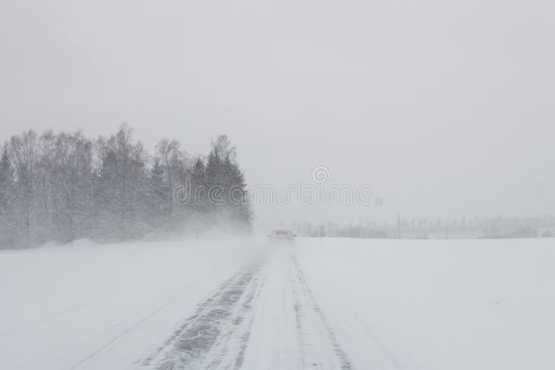 Car in a snow storm stock image Car in a snow storm stock image