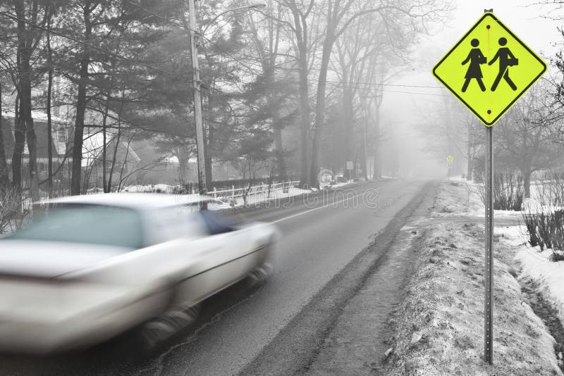 Car speeding in a school zone stock photography