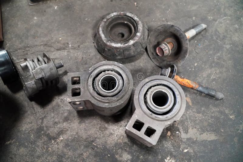 The car suspension bushings in parts replacement and car lift in the garage,Car suspension arm repair,Auto service industry