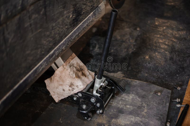 Car Suspension Repair. Hydraulic Jack, Car Wheel Replacement Stock