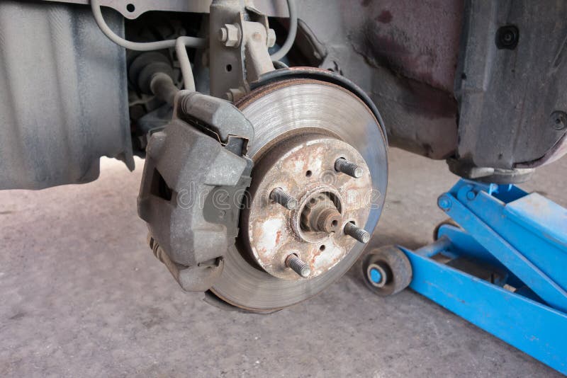 Modern Car Take Wheel Off Show Brake Disk and Caliper Assembly Stock