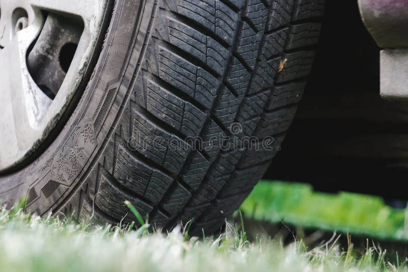 Car Tire on the Green Grass Stock Photo Image of challenge, action