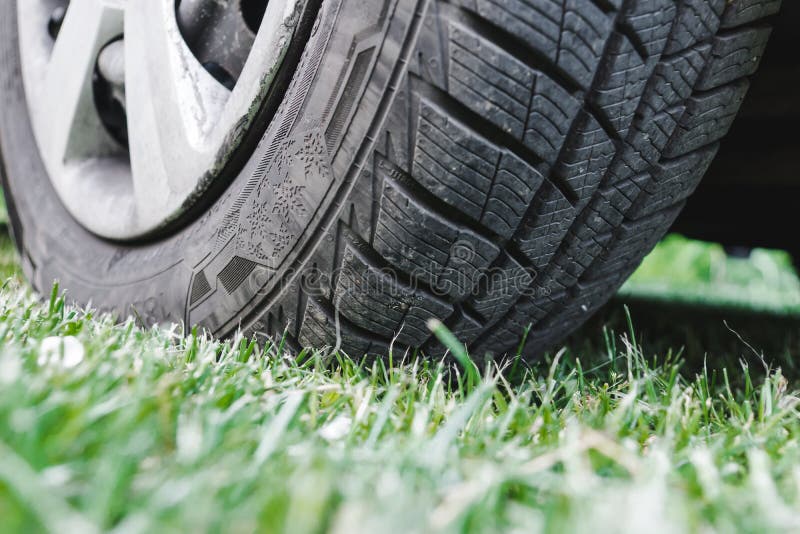 Car Tire on the Green Grass Stock Photo Image of offroad, ecological
