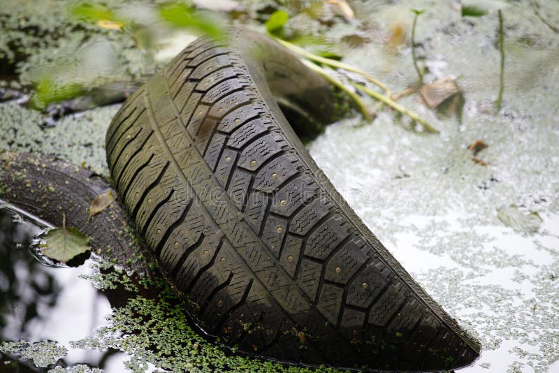 Car tire in the water. accident concept