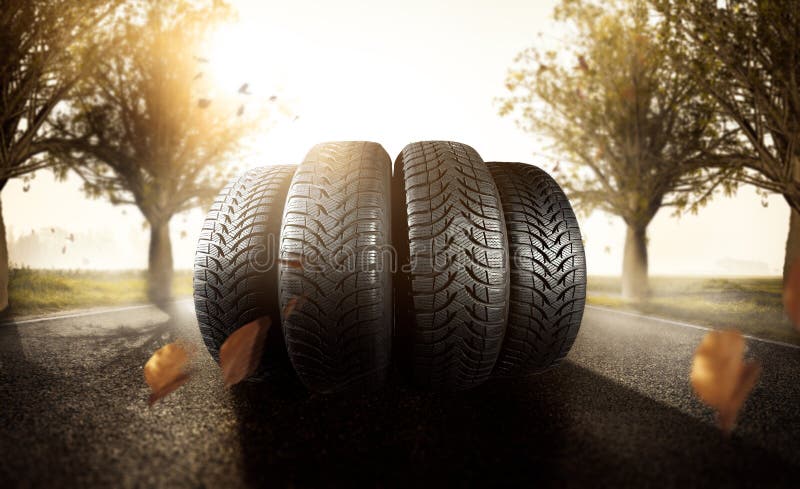 Car tires on a autumn road