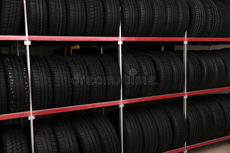 Car tires on rack in store stock image. Image of equipment 172440097