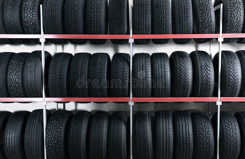 Car tires on rack in store stock photo. Image of shelves 172130478
