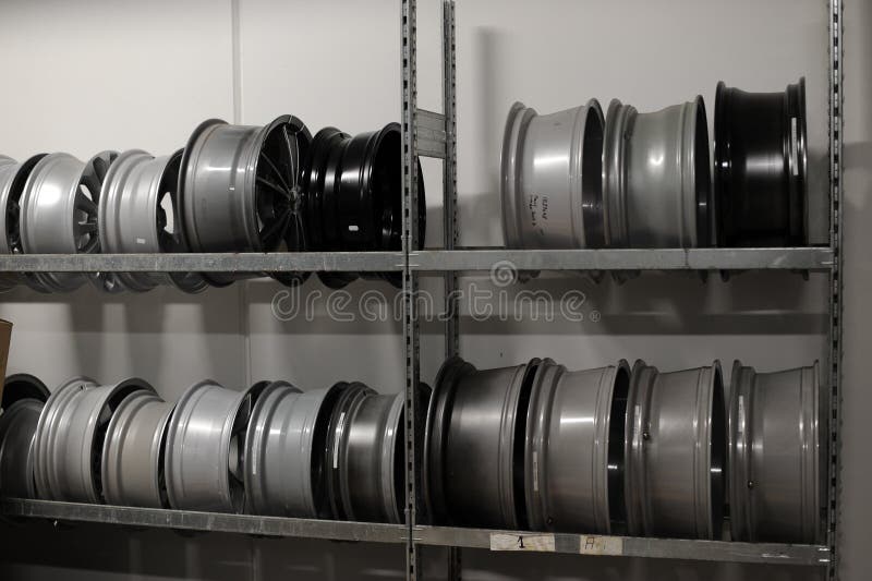 Car Tires and Wheels at Warehouse in Tire Store. Stock Photo Image of