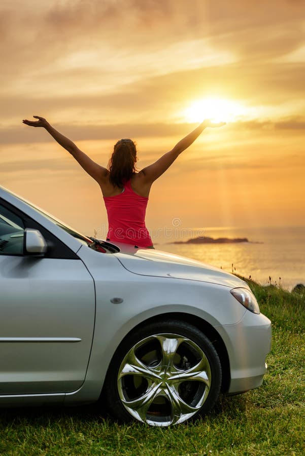 Car traveler looking summer sunset