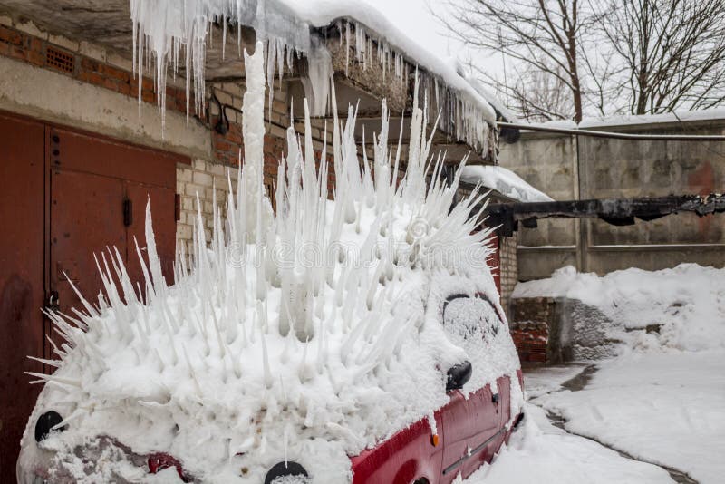The Car Under Snow Is Stuck With Large Icicles Stock Photo Image of porcupine, roof 140749296